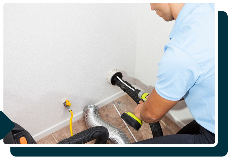 Man cleaning out a dryer vent