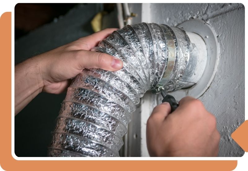 a person securing a dryer vent